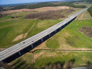 highway bridge in rural area - aerial view of a big highway bridge in rural area in germany european - cars drive over the highway bridge - drone flight