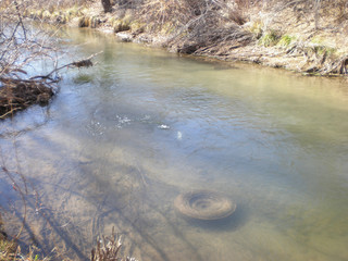 Tire Trash Pollution in Stream