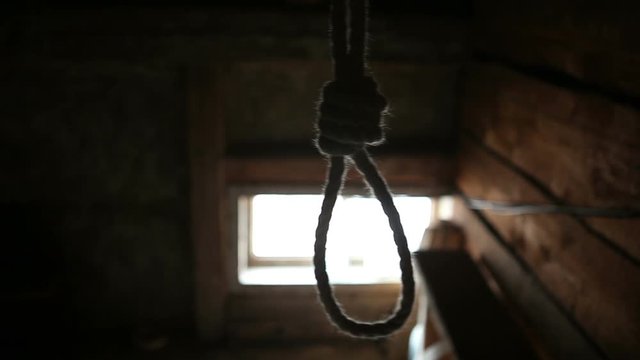 Preparing suicide. In the barn hanging loop opposite the window. 5 minutes before death.Concept
