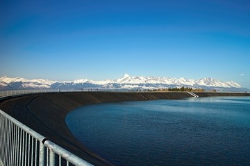 The most famous Slovak peak in the High Tatras - Krivan. A view of the Cierny Vah hydroelectric power plant.