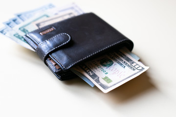 Leather wallet with dollar bills 
