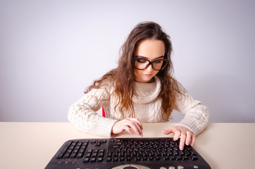 Funny nerd girl working on computer
