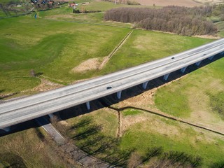 highway bridge in rural area - aerial view of a big highway bridge in rural area in germany european - cars drive over the highway bridge - drone flight