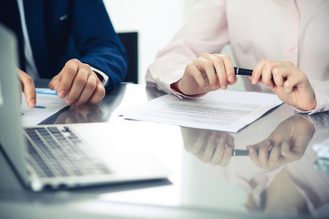 Group of business people and lawyers discussing contract papers. Success at meeting or negotiation