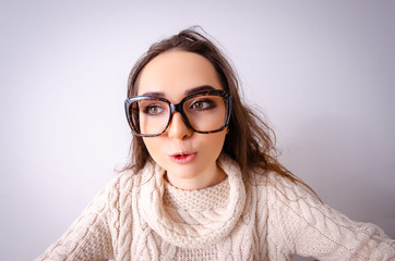 Funny nerd girl working on computer