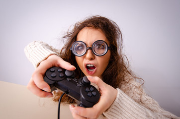 Funny nerd girl working on computer