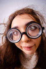 Funny nerd girl working on computer