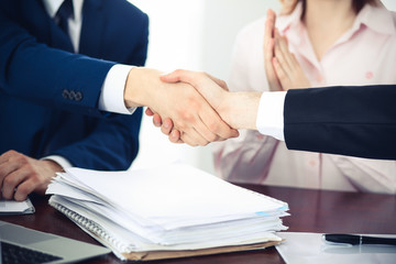 Business people shaking hands finishing up a meeting. Handshake at successful negotiation