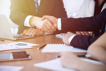 Business people shaking hands at meeting or negotiation in the office. Handshake concept. Partners are satisfied because signing contract