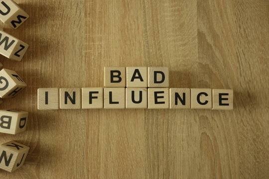Bad influence text from wooden blocks on desk