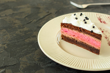 cake mousse berry, chocolate biscuit - dessert is sweet and tasty. piece of cake. food background. top