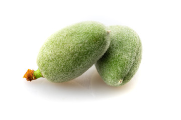 green almond on white background