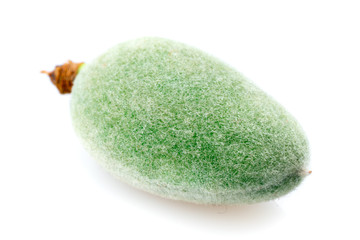 green almond on white background