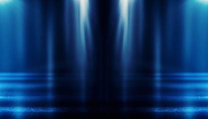 Background of empty dark room with rays of light. Concrete floor with light reflection. Smoke, neon blue light