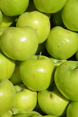 green apples on background