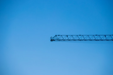 Construction crane against a clear blue sky