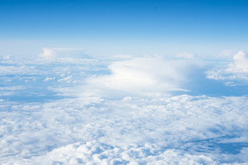Impressive cloudscape with white clouds beneath