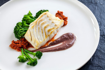 Cod loin with black olives puree and sundried tomatoes