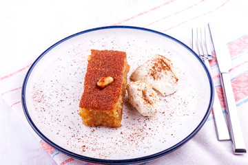 Traditional Turkish dessert - sambali, sambaba or damascus with cream and cinnamon powder