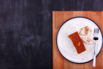 Traditional Turkish dessert - sambali, sambaba or damascus with cream and cinnamon powder