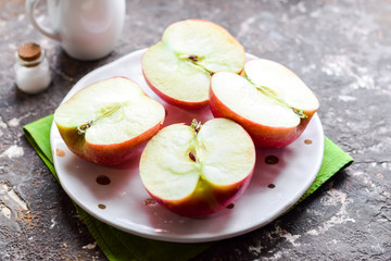 Halved red apples.
