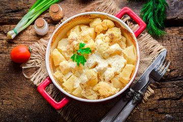  Baked potatoes with sour cream and cauliflower.