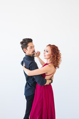 Romantic, social dance, people concept - couple dancing the salsa or kizomba or tango on white background