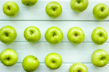 summer food with apples on light wooden background top view pattern