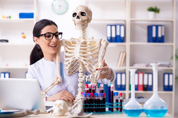 Young female archaeologist working in the lab 