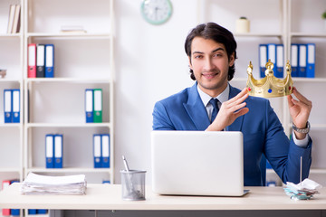 Young king businessman working in the office 