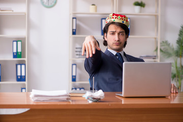 Young king businessman working in the office 