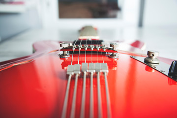 red guitar on desk
