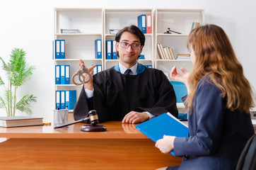 Young woman visiting male lawyer 