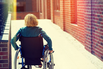 woman on wheelchair entering the platform