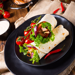 Tasty wraps filled with pulled pork and salad