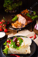 Tasty wraps filled with pulled pork and salad