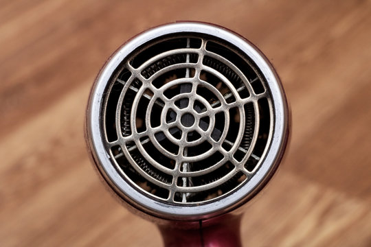 Fan blow dryer closeup on wooden background