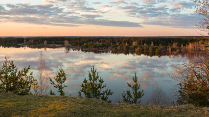 reflection of clouds in the river in the evening
