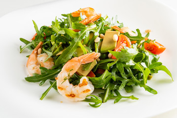 salad with shrimps, rocket salad and cherry tomatoes