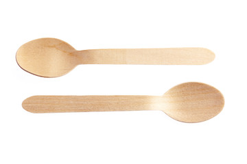 Eco-friendly materials. Wooden, disposable spoon on a white background.