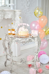 Wedding cake with candles and flowers.