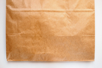 part of package of Kraft paper on white background, copy space