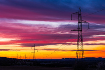 Fototapeta na wymiar silhouetted high voltage tower at sundown