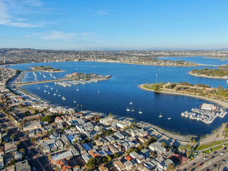 Aerial view of Mission Bay & Beaches in San Diego, California. USA. Community built on a sandbar with villas, sea port.  & recreational Mission Bay Park. Californian beach-lifestyle.