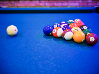 billiard snooker pyramid balls on pool blue table