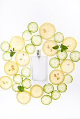 Citrus refreshing fruity perfume. Fruit background and perfume bottle.