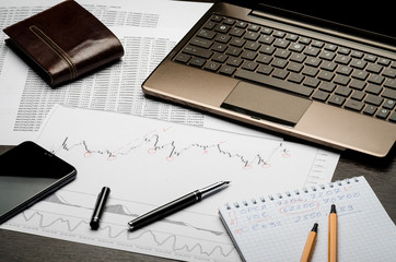 Financial charts and reports on paper, currency analysis, broker's workplace