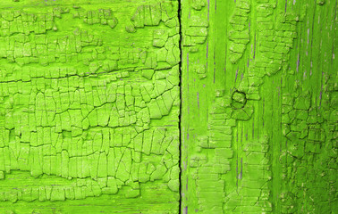 Old wooden background with remains of pieces of scraps of old paint on wood. Texture of an old tree, vintage wood background peeling paint. old blue board with cracked paint