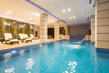 Foto auf Glas Swimming pool in hotel spa and wellness center © rilueda