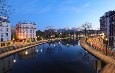 Fototapeta premium The Canal Saint-Martin at night .It is long canal in Paris, connecting the Canal de l'Ourcq to the river Seine.